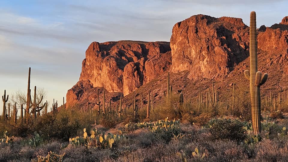 Orange glow of the sunset against the Superstition Mountains in Arizona